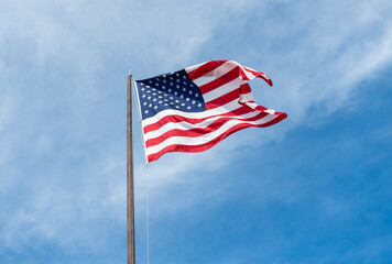 National waving flag of united states on sky. Independence day. Patriotic symbol. American Flag for...
