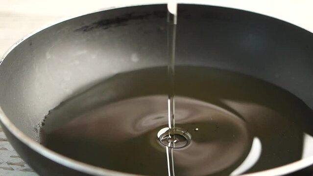  slow motion of Pouring vegetable oi in a spoon 