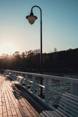 White Old wood bridge pier against beautiful sunset sky natural background, backdrop wallpaper...