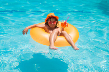 Cocktail kids summer. Kid floating in pool. Child relaxing in pool, drink summer cocktail. Little child boy swimming in summer pool. Cute kid relaxing and floating on swimming pool.