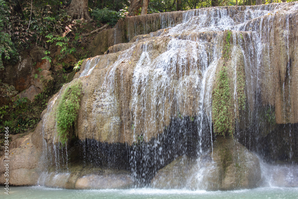 Sticker waterfall along a tropical river in thailand