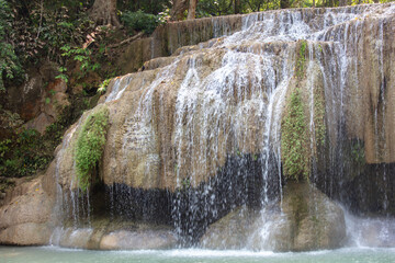 Obraz premium Waterfall along a tropical river in Thailand