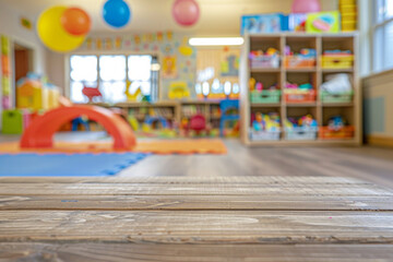 Fototapeta premium A wooden play table in the foreground with a blurred background of a children's playroom. The background includes colorful toys, bookshelves with children's books, soft play mats, and cheerful.