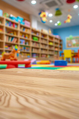 A wooden play table in the foreground with a blurred background of a children's playroom. The background includes colorful toys, bookshelves with children's books, soft play mats, and cheerful.
