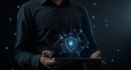 Hand holding digital tablet with security shield symbol