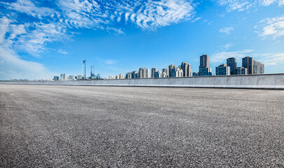 Obraz premium Empty asphalt road and modern city skyline in Suzhou
