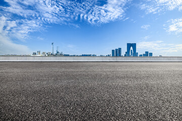 Empty asphalt road and modern city skyline in Suzhou