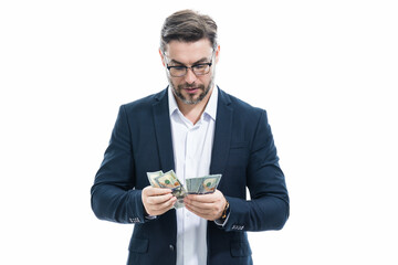 Man with money cash. Dollar banknotes. Portrait of businessman holding money banknotes. Dollar bills, credit, online banking. Rich man pointing at dollar banknotes, bank loan, financial savings.