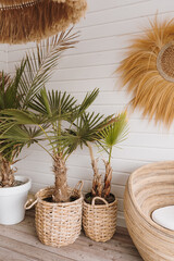 Furniture made of dried palm leaves, straw, rattan. Aesthetic bohemian interior with straw and...