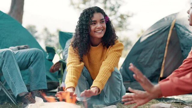 Heating, hands and friends at fire on camping adventure in forest or burning wood in nature. Flame, smoke and travel in environment on vacation in countryside with group of people to relax at bonfire