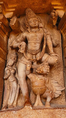 Broken Sculpture of Lord Vishnu with Garuda on the Durga Temple, Aihole, Bagalkot, Karnataka, India.