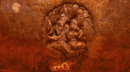 Carving of Hindu Deities on the Ceiling of Badami Caves, Badami, Bagalkot, Karnataka, India.