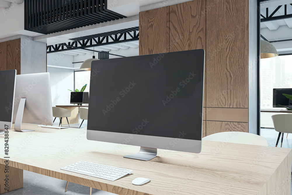 Poster Modern coworking office with close up of mock up computer monitor, equipment, furniture, various other objects and daylight. 3D Rendering.