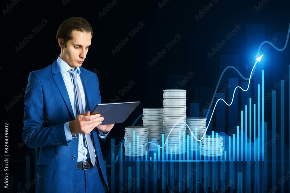 Poster attractive thoughtful young european man using tablet with creative hologram with growing chart and 