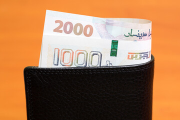 Algerian dinar in the black wallet