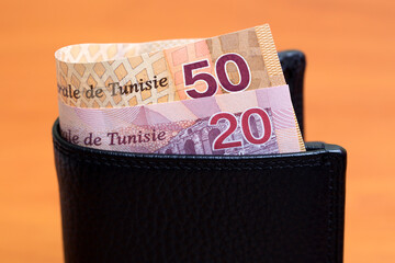 Tunisian dinar in the black wallet