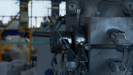 Cable production process, mechanism in a cable factory. Creative. Stretching cable and machinery.