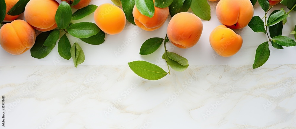 Poster a delicious assortment of apricots accompanied by vibrant green leaves presented on a white tiled ta