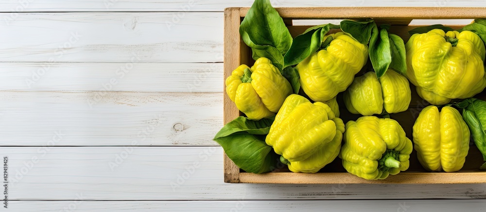 Poster Fresh ripe pattypan squashes in wooden crate on light grey table top view Space for text. copy space available