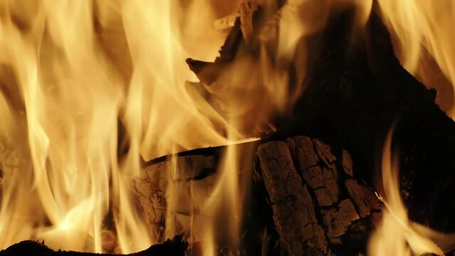 burning flames in fireplace close up detail