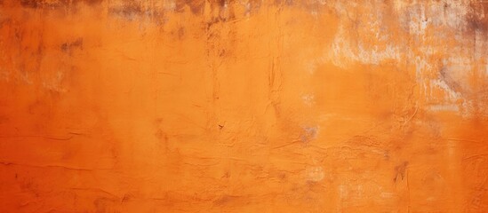 Fototapeta premium Orange grungy wall background with a textured stucco surface Image with copy space