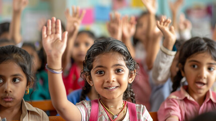 Multiple kids seated in classroom, raising hands