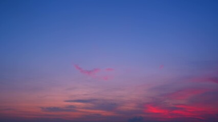 A stunning sunset with vibrant hues of pink, purple, and blue blending seamlessly across the sky....
