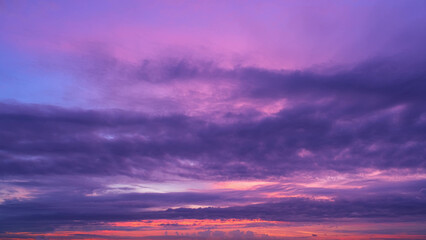 A breathtaking sunrise with a palette of deep purples and pinks. The vibrant colors fill the sky,...