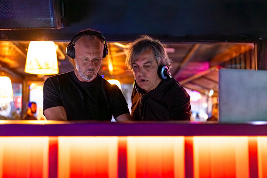 DJs playing music at night club