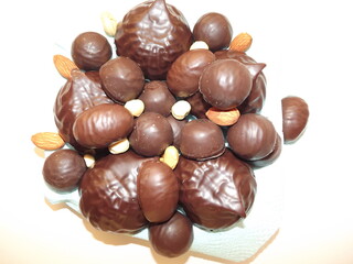 chocolate candies, marshmallows, marmalade and various nuts close-up