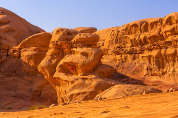 Wadi Rum desert with orange sand and rock formations in Jordan, Middle east