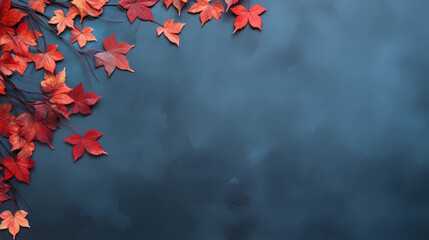 Autumn background with colored red leaves on blue slate background. Top view, copy space 