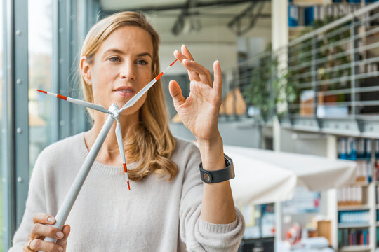 Woman in office working on wind turbine model