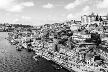Aerial view of Porto old town, Ribeira Pier and the Douro River waterfront in Porto, Portugal in black and white