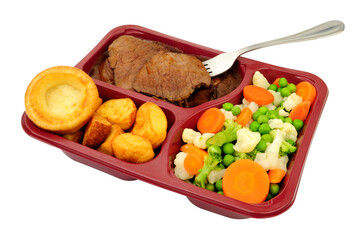 Roast beef ready meal with sliced silverside beef, gravy, roast potatoes, mixed vegetables and Yorkshire pudding in a sectional plastic tray