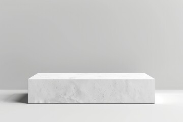 A plain rectangular podium made of white plaster, with a smooth surface and sharp edges, placed on a clean background