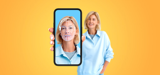 Woman showing phone and biometric scanning hologram, face swapping