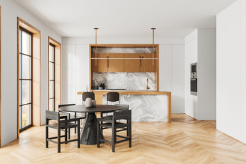 Luxury home kitchen interior with bar island and dining table, panoramic window