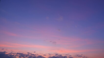 A beautiful sunset sky with soft hues of purple, pink, and orange blending seamlessly. The delicate...