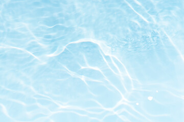 Blue water with ripples on the surface. Defocus blurred transparent blue colored clear calm water...