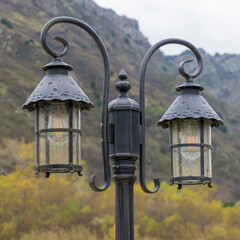 Street lamps on an iron pole with curved pendants