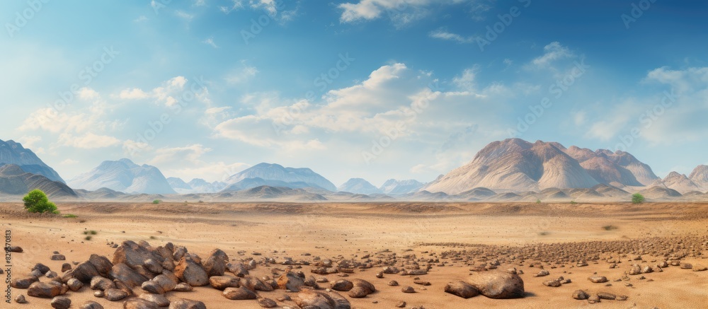 Poster Scenic view with rocks sand and a lush mountain in the background ideal for a copy space image