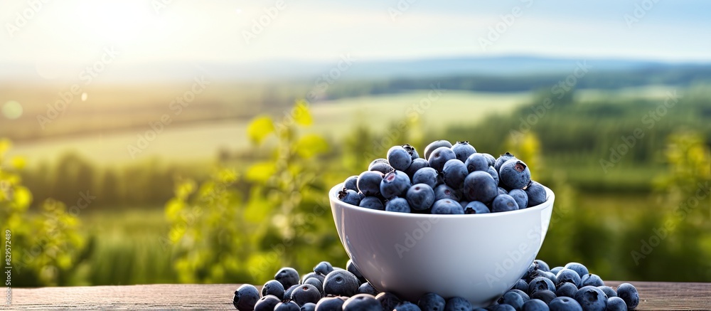 Poster blueberries in a cup on the table with a scenic background ideal for copy space image