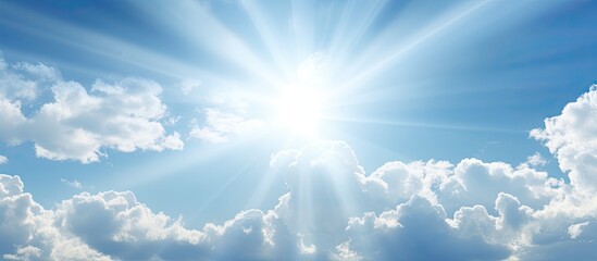 Bright sunshine illuminating a cloudy sky with copy space image