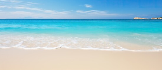 Sea with golden sand beach and clear blue waters ideal for vacation concept with copy space image