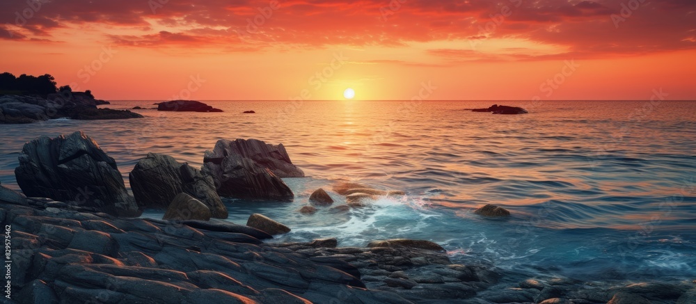 Poster scenic view of stones with sunset and ocean in the background perfect for a copy space image