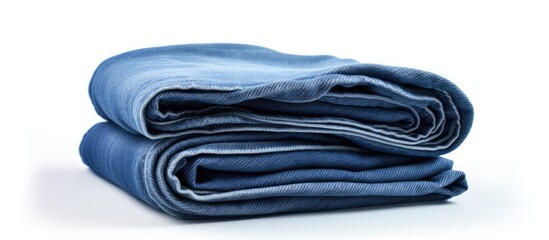 A set of three folded blue jeans arranged on a white background providing ample copy space for the image
