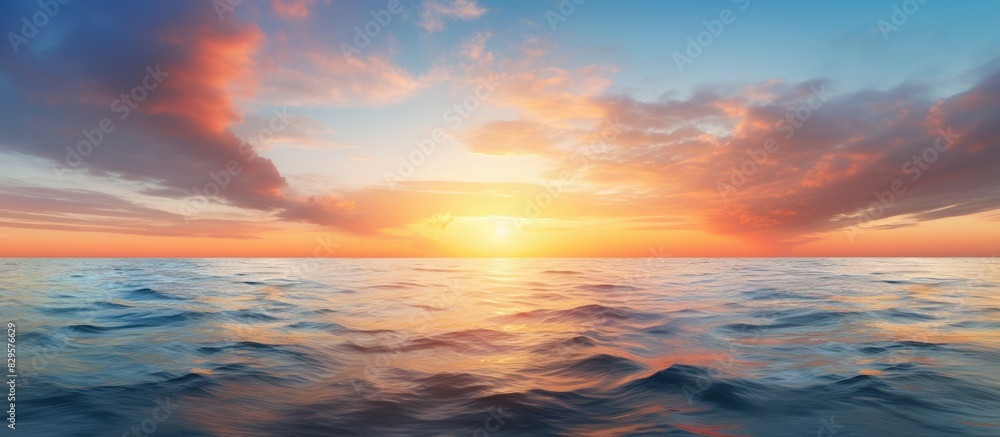 Poster Scenic sunrise over the tranquil ocean with sun reflection capturing a serene moment in a copy space image