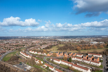 Obraz premium Aerial photo of the British town of Leeds in West Yorkshire UK, showing the Leeds City Centre taken with with a drone on a bright sunny day in the town of Holbeck near to the centre.