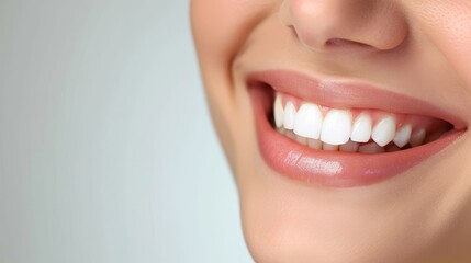 Obraz premium Perfect healthy teeth smile of a woman isolated on a white background.